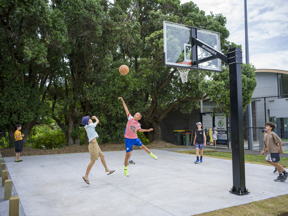 Children playing basketball. 