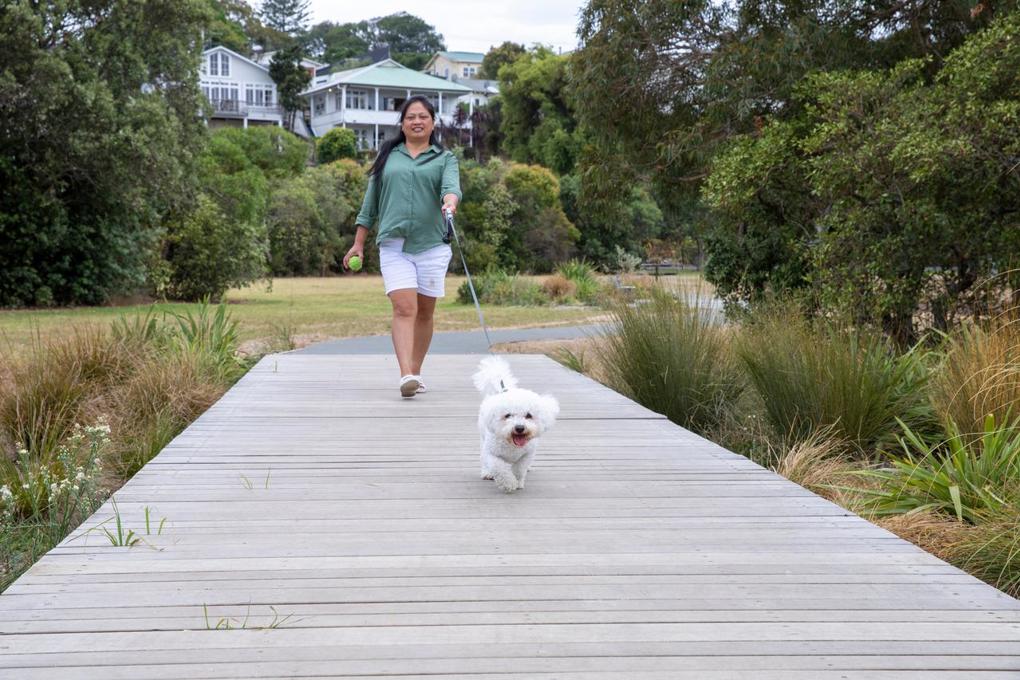 Woman walking dog