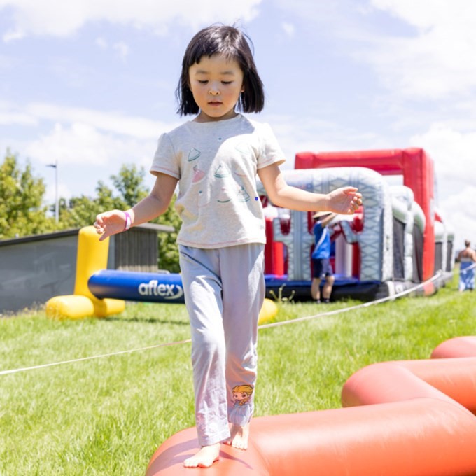 Young Girl On The Inflatable Balance Beam