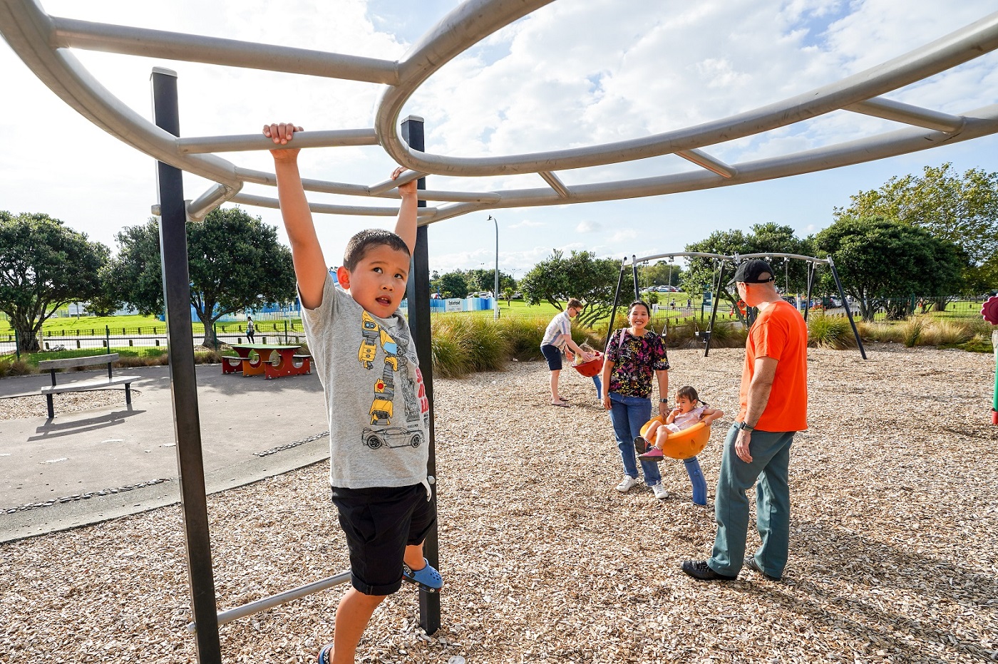 The Schofield family enjoying the playground at Lloyd Elsmore Park