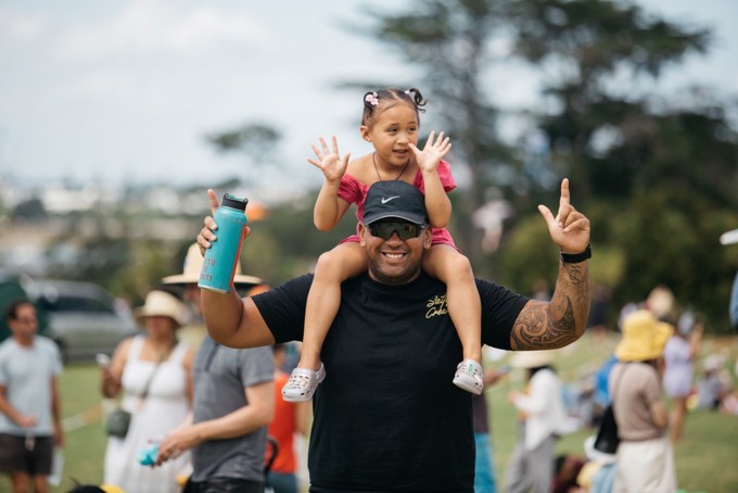 A Man With A Girl On His Shoulders