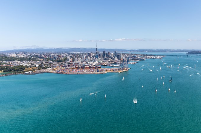 Auckland From A Distance With Lots Of Boats In Water, Harbour Bridge And Skytower In The Distance
