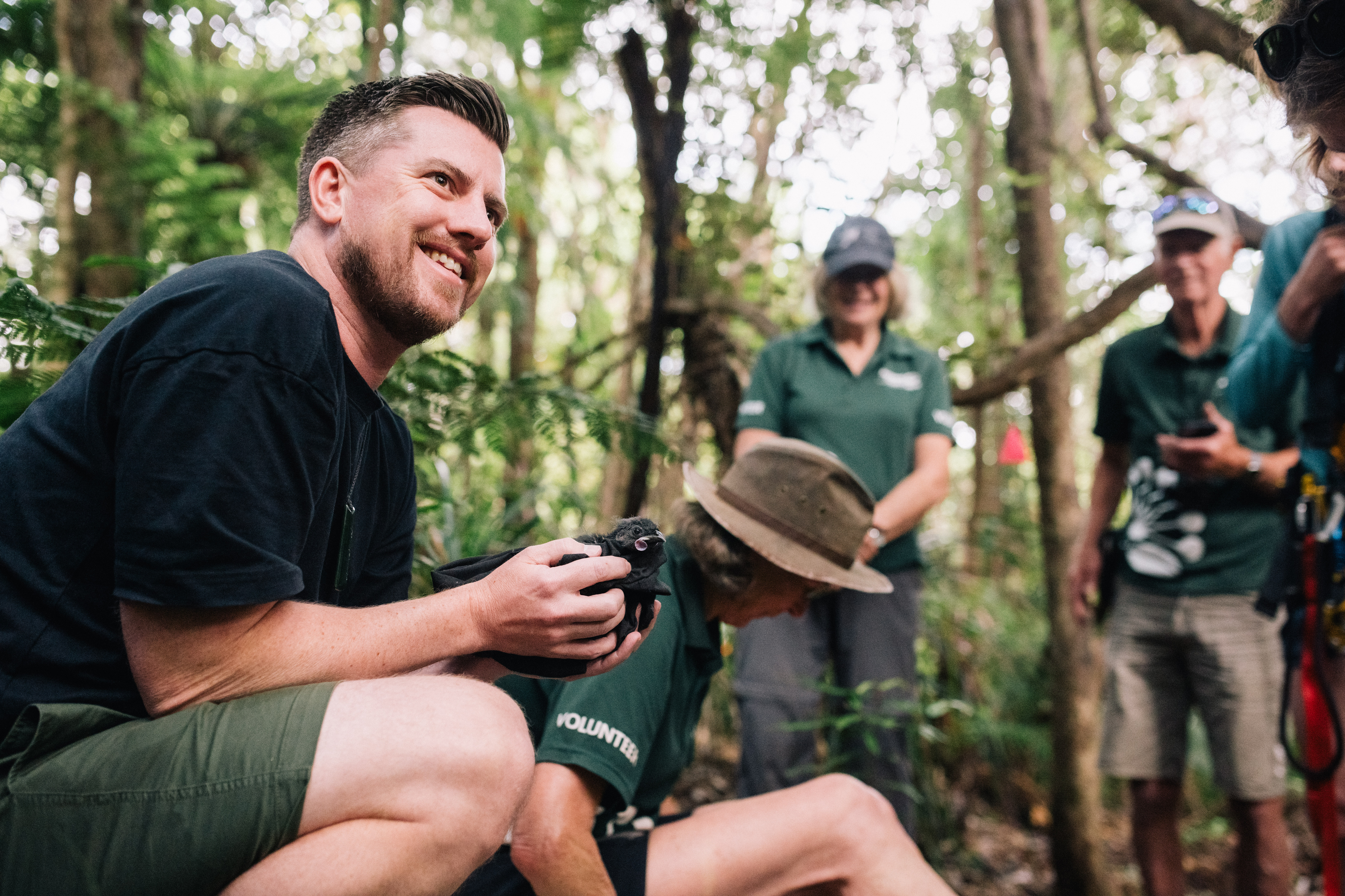 Cr Richard Hills with a Kōkako in the Hūnua Ranges Regional Park – a NETR funded project.