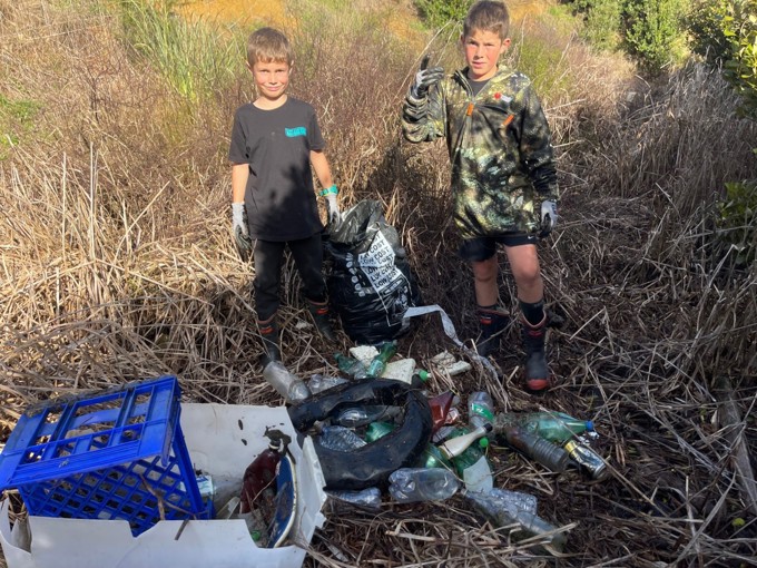Boys Cleaning Up Trash In Papakura
