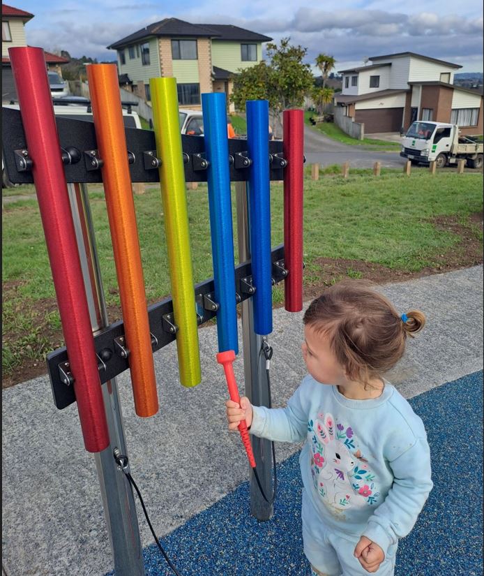 Child playing the Xylophone.