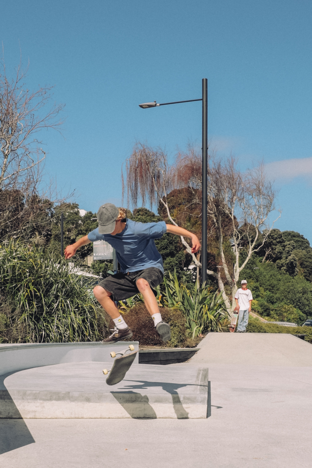 Skateboarder performing trick mid-air at Panmure Skate Park