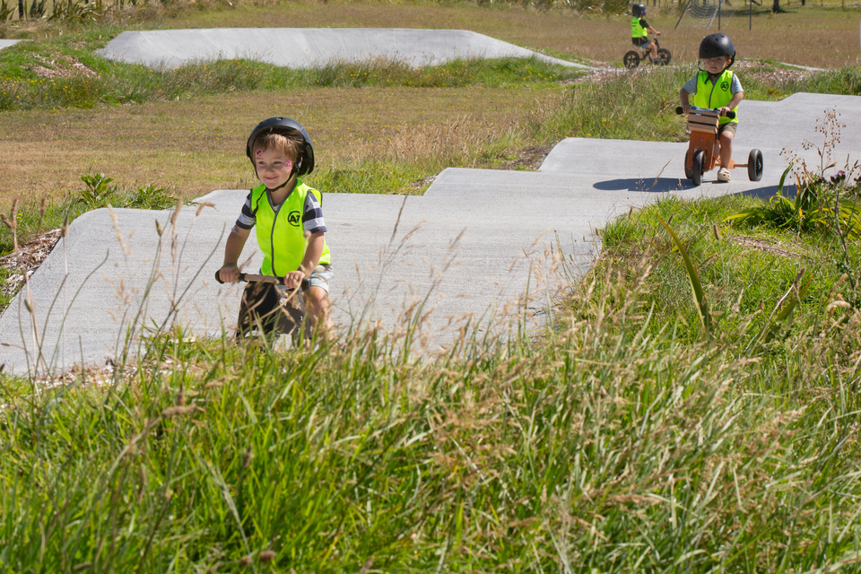 A child riding a bike. 