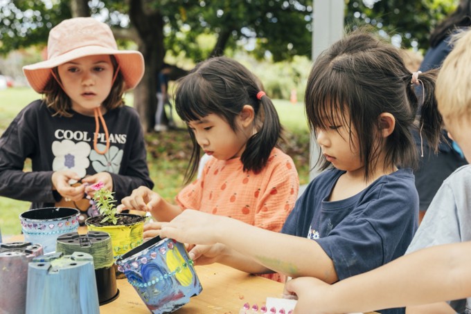 Kids Planting In Pots