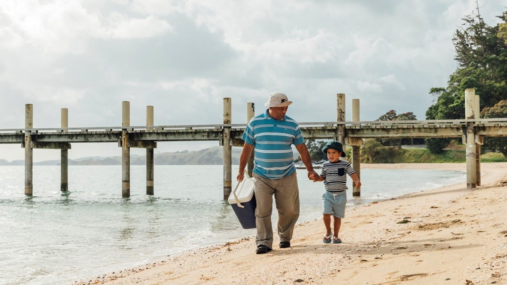 Man and young boy on the beach