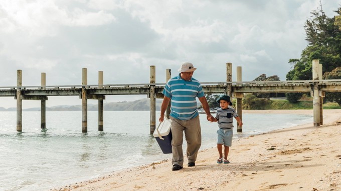 Man and young boy on the beach
