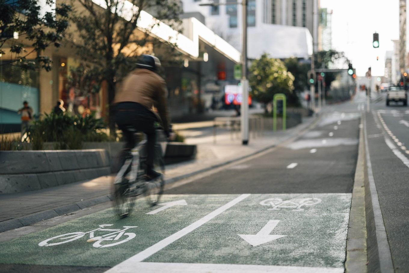 A cyclist riding up Victoria St. 