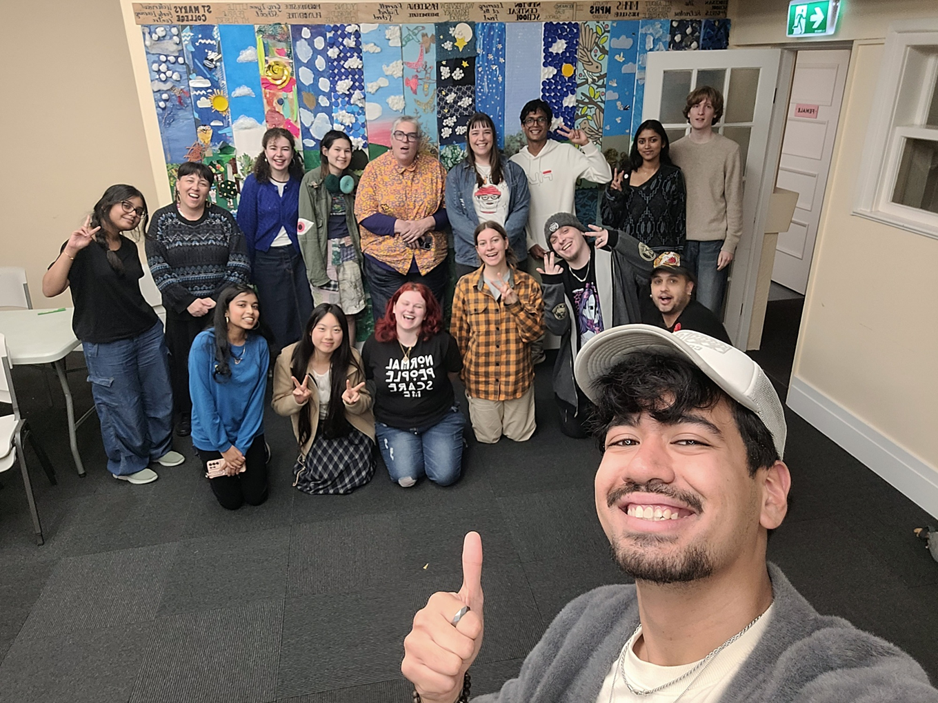 A group of young people in a classroom. 