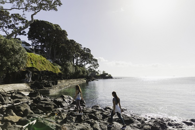 Women Walking On Rocks Next To The Sea (1)