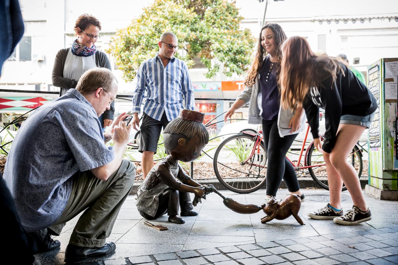People looking at a public artwork.