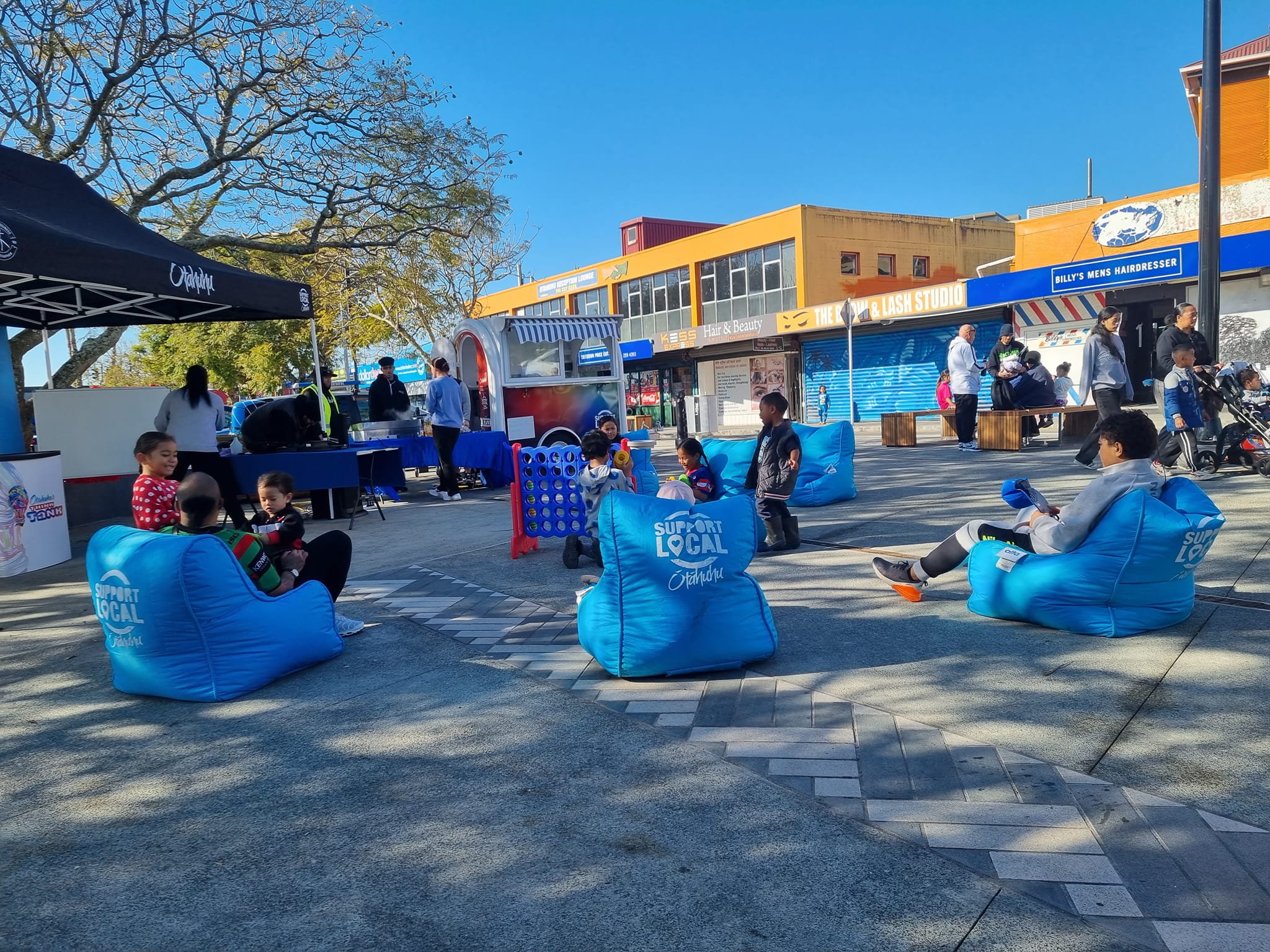 Community enjoying the free activities put on by Ōtāhuhu Business Association.