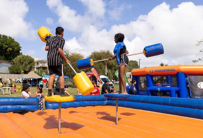 Children playing with inflatable jump pads