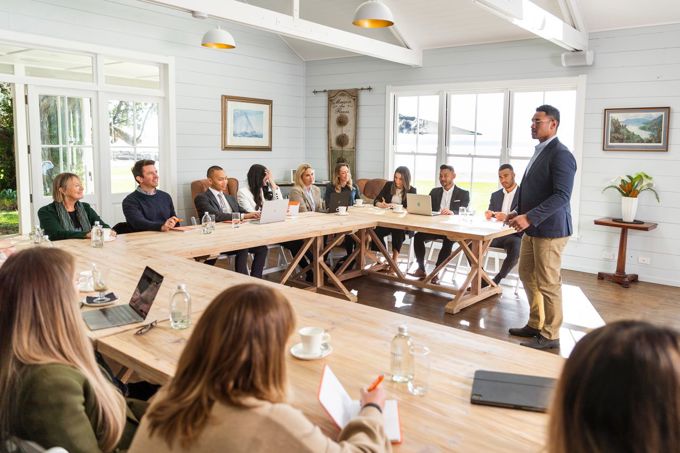 Group Of Delegates Listening To Presenter