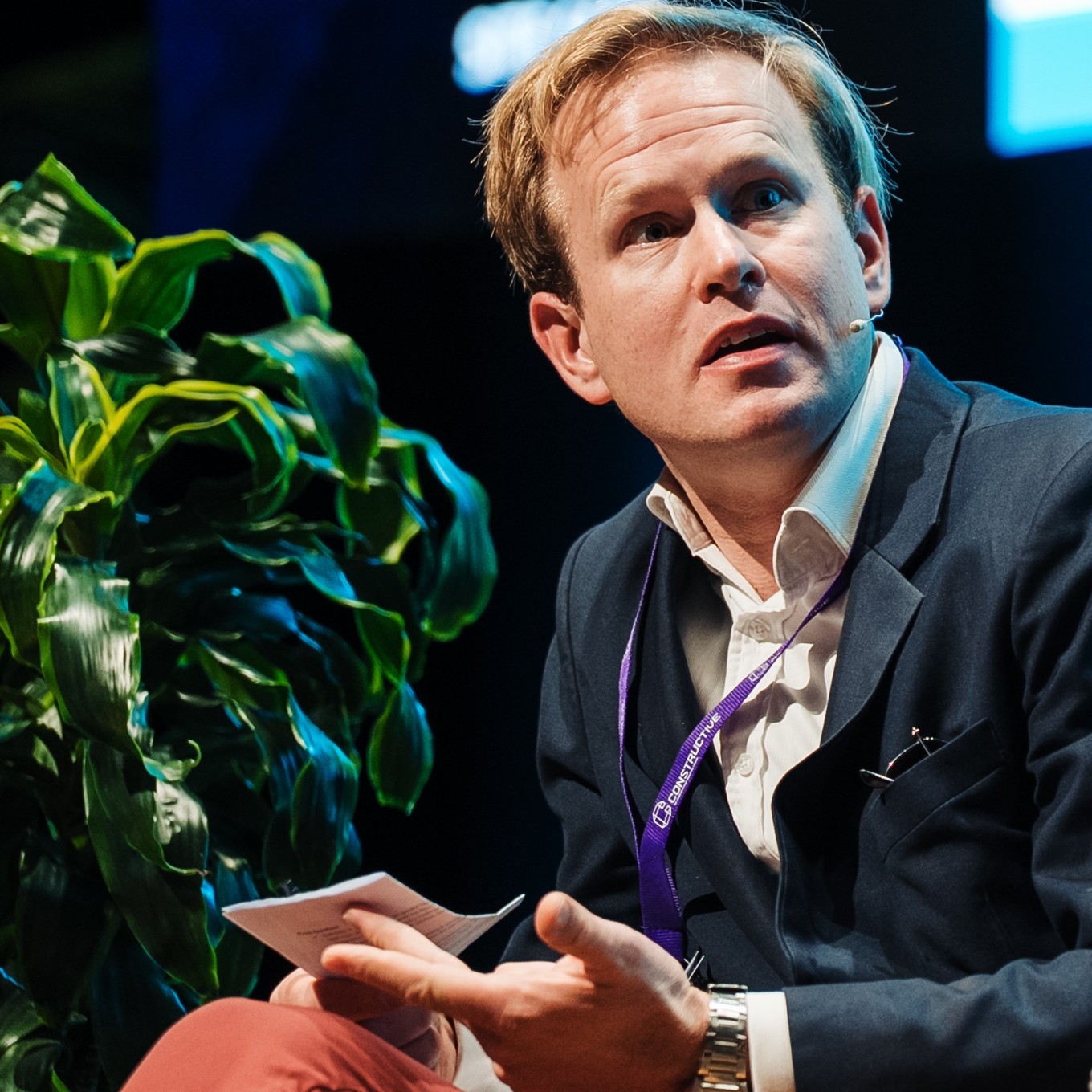 A guy speaking on a stage. 