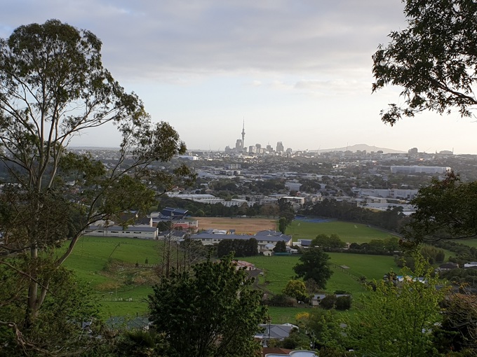 City kids farming with view of Sky Tower