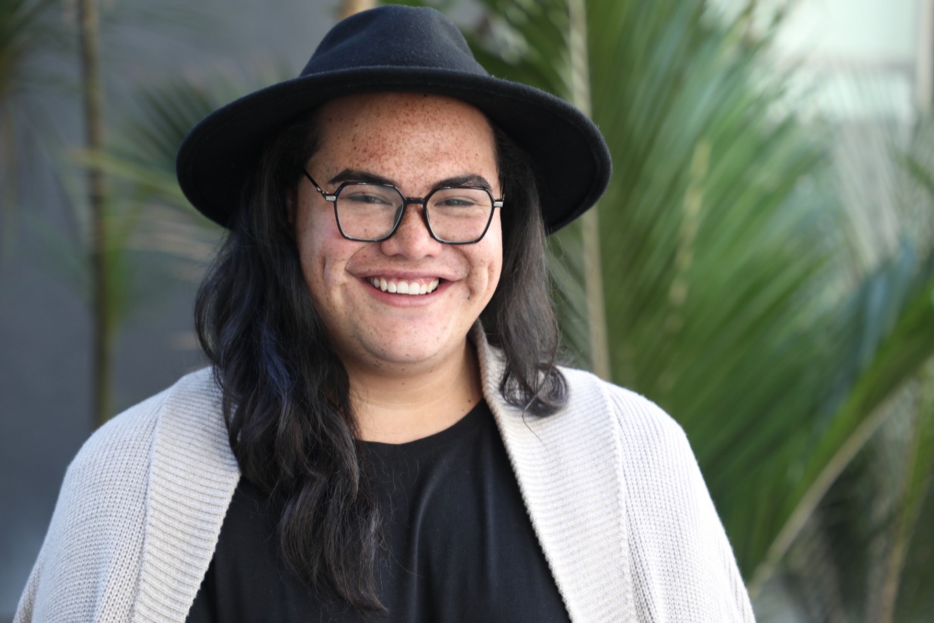 A lady in a black hat. 