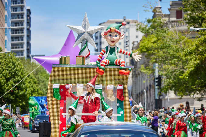 Elf mascot on Christmas float