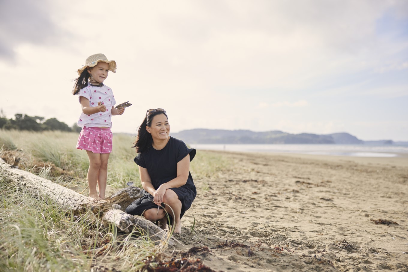 Young child and mother at the beach.