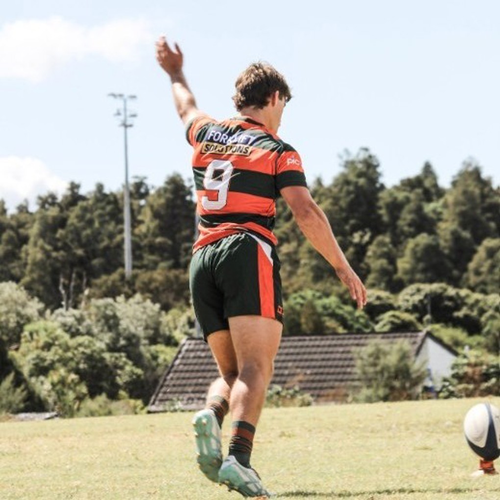 Rugby Player Going To Kick Ball