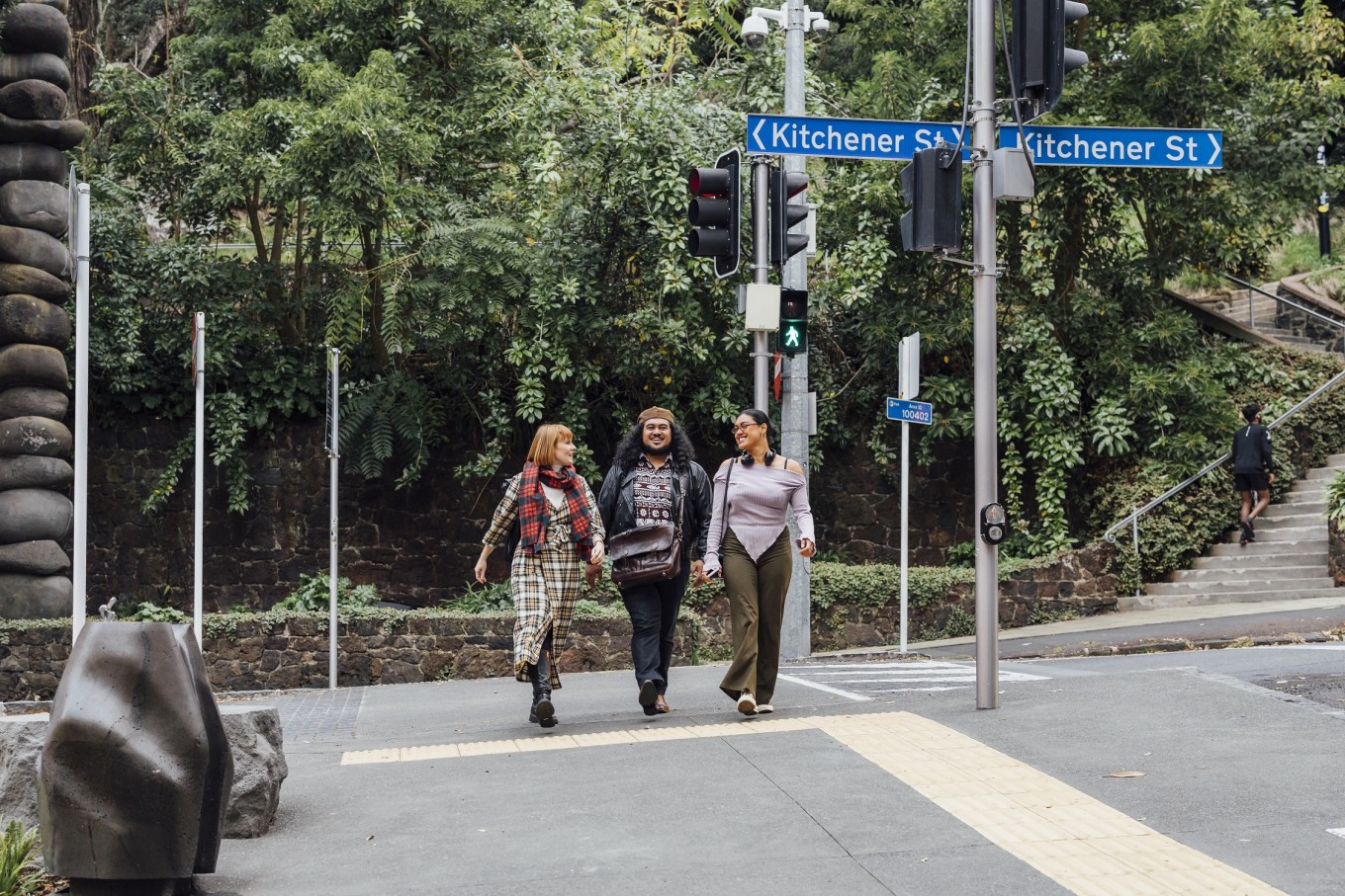 Young people walking down Victoria St.