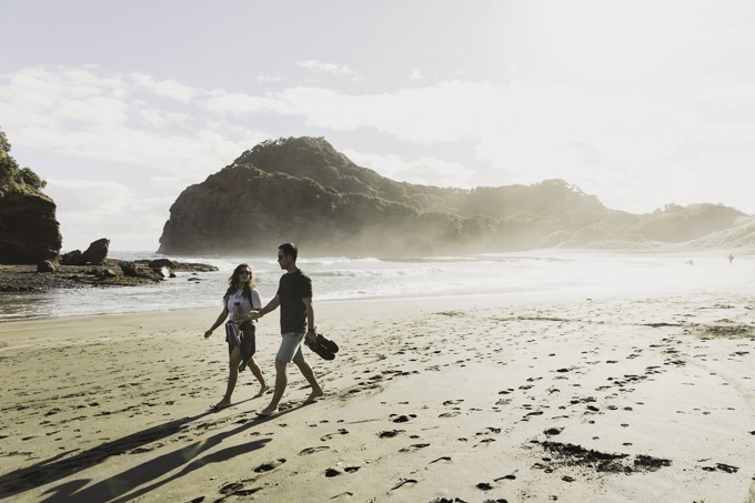 Woman And Man Enjoying A Beach Walk Resize