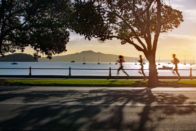 Joggers Running Along Coastal Walk Tamaki Drive Mission Bay Auckland With Rangitoto Island Views