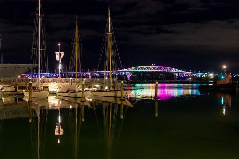 The Auckland Harbour Bridge lit up for Auckland Pride Festival. 