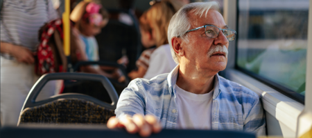 Senior Man Sitting On A Bus AT Suppied