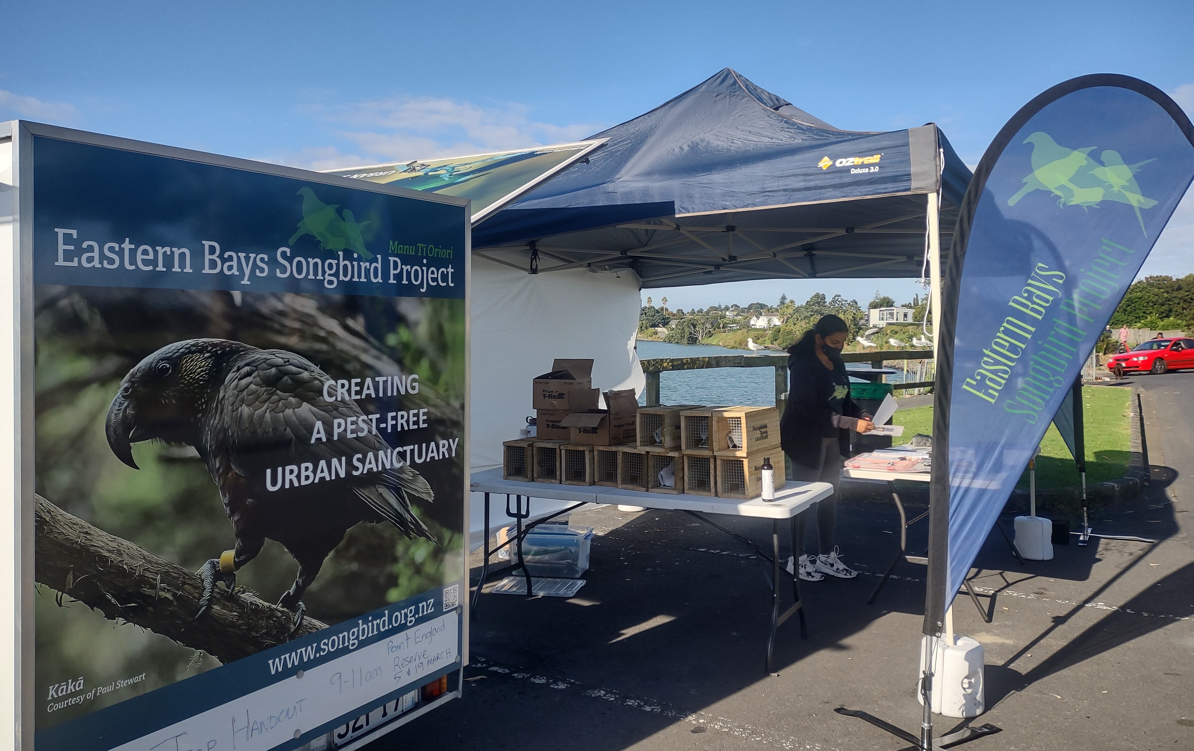 Eastern Bays Songbird Project hold a stall providing traps to community