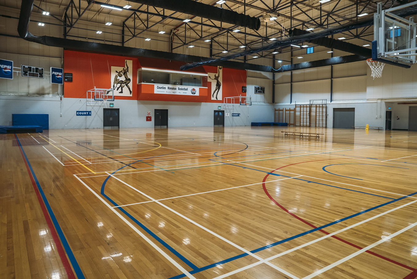 A newly polished basketball court.